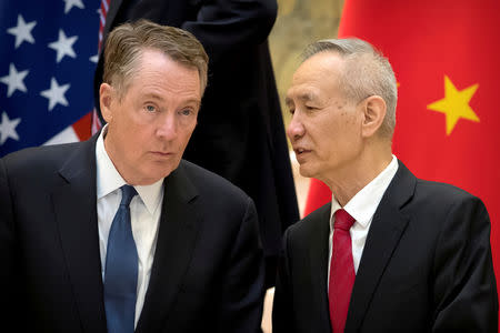 FILE PHOTO: FILE PHOTO: U.S. Trade Representative Robert Lighthizer, left, listens as Chinese Vice Premier Liu He talks while they line up for a group photo at the Diaoyutai State Guesthouse in Beijing, China February 15, 2019. Mark Schiefelbein/Pool via REUTERS/File Photo/File Photo