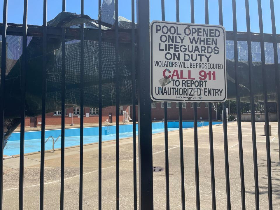 The empty pool at the Hamlin Park Pool remains closed to swimmers in Chicago, Thursday, June 16, 2022. Chicago's public pools will remain closed until July 5, 2022, according to park superintendent and CEO Rosa Escareño. The city, like the rest of the U.S., is experiencing a critical shortage of lifeguards and is offering $600 retention bonuses to attract new applicants. (AP Photo/Claire Savage)