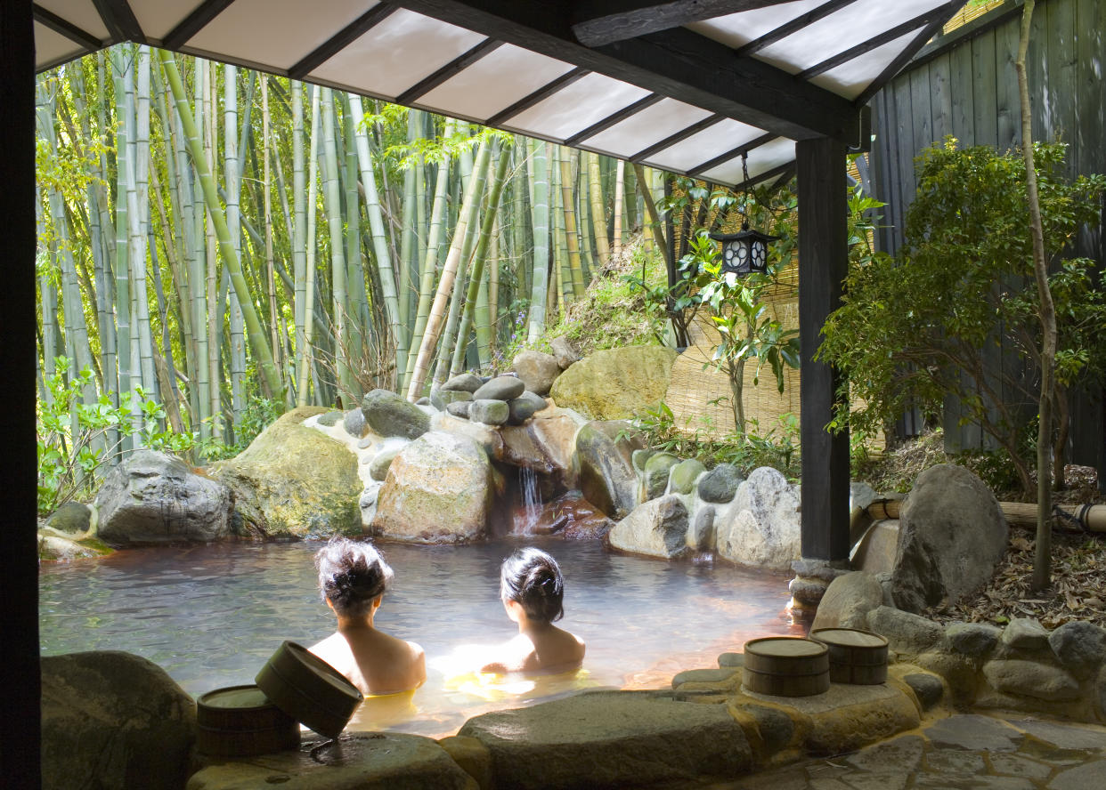 Women bathing in an outdoor pool at Yumotoso, a hot spring resort in Kurokawa Onsen. (Photo: Gettyimages)