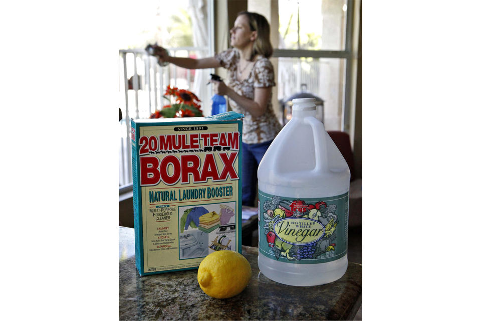 FILE - Wendy Brooks cleans her windows with white vinegar and newspapers at her home on April 1, 2009, in Phoenix. On Friday, July 28, 2023, The Associated Press reported on stories circulating online incorrectly claiming that taking borax daily can help with a range of ailments, including osteoporosis, kidney stones, chronic fatigue and erectile dysfunction. (AP Photo/Matt York, File)