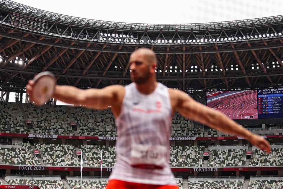 The grandstands are empty due to the Covid-19 pandemic, as Bartlomiej Stoj of Team Poland competes in the Men's Discus qualification, on day seven of the Tokyo 2020 Olympic Games.