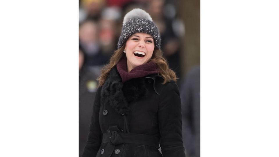 Kate Middleton wearing a bobble hat as reacts after hitting the ball as she attends a Bandy hockey match with Prince William, Duke of Cambridge, where they will learn more about the popularity of the sport during day one of their Royal visit to Sweden and Norway on January 30, 2018 in Stockholm, Sweden.  