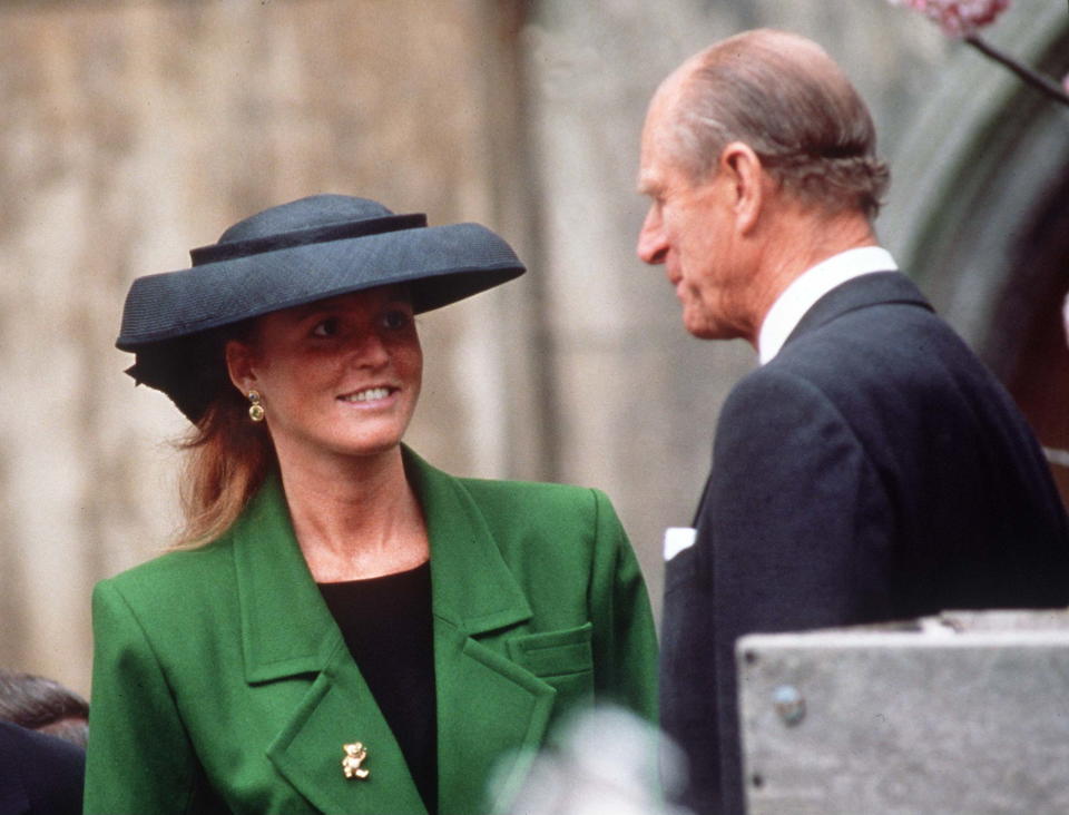 Sarah Ferguson in a green coat and black hat with Prince Philip