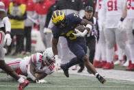 Michigan wide receiver A.J. Henning (3) pulls away from Ohio State linebacker Steele Chambers (22) during the first half of an NCAA college football game, Saturday, Nov. 27, 2021, in Ann Arbor, Mich. (AP Photo/Carlos Osorio)