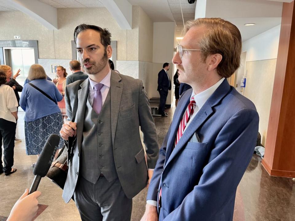  Attorneys Aaron Kemper, left, and Ben Potash, speak with media after the arguments. (Kentucky Lantern photo by Sarah Ladd)