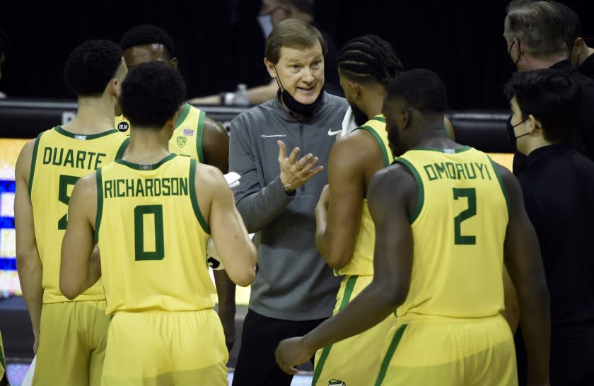 Oregon head coach Dana Altman talks with his during the second half of an NCAA college basketball game Thursday, Feb. 18, 2021, in Eugene, Ore. (AP Photo/Andy Nelson)