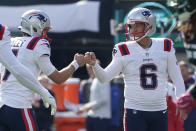 New England Patriots place kicker Nick Folk (6) is congratulated by teammates after kicking a field goal against the New York Jets during the first quarter of an NFL football game, Sunday, Oct. 30, 2022, in New York. (AP Photo/John Minchillo)