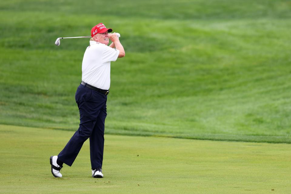 BEDMINSTER, NEW JERSEY - AUGUST 10: Former President Donald Trump hits his shot from the first fairway during the pro-am prior to the LIV Golf Invitational - Bedminster at Trump National Golf Club on August 10, 2023 in Bedminster, New Jersey. (Photo by Mike Stobe/Getty Images)