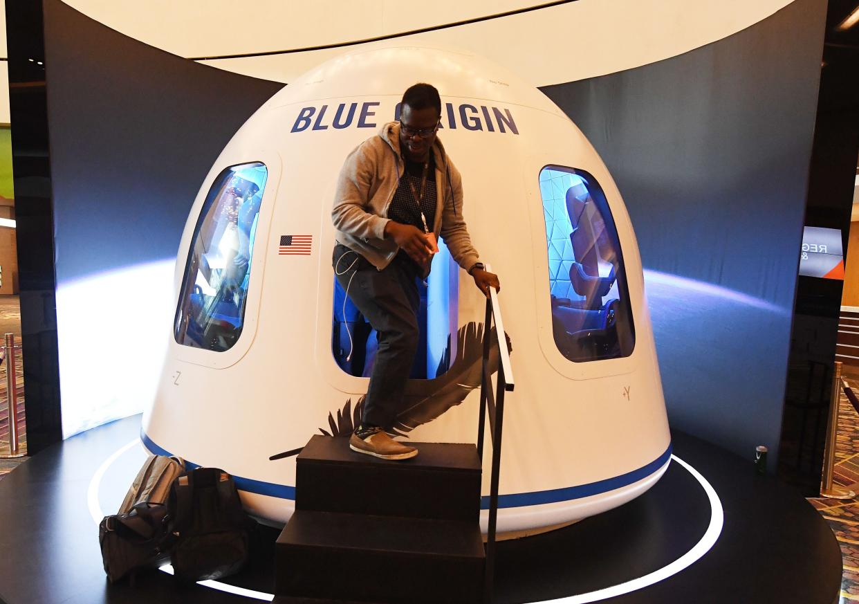 Participants leave the Blue Origin Space Simulator during the Amazon Re:MARS conference on robotics and artificial intelligence at the Aria Hotel in Las Vegas (AFP via Getty Images)