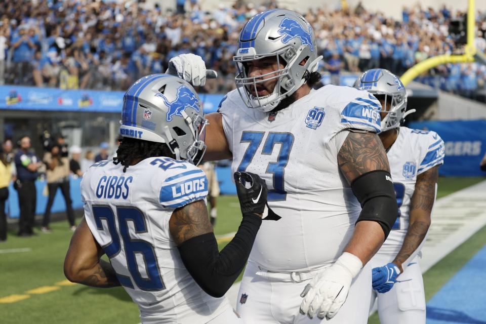 Jahmyr Gibbs of the Detroit Lions and Jonah Jackson of the Detroit Lions celebrate a touchdown during the second quarter against the Los Angeles Chargers at SoFi Stadium on November 12, 2023 in Inglewood, California.