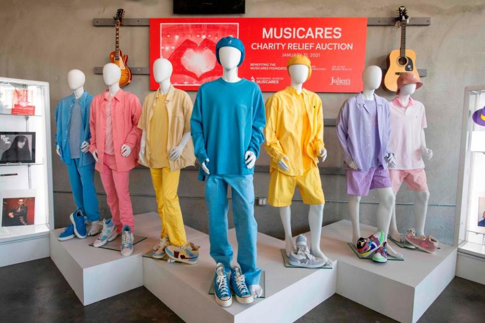 BTS’s clothes from the Dynamite video displayed for the auction in January.