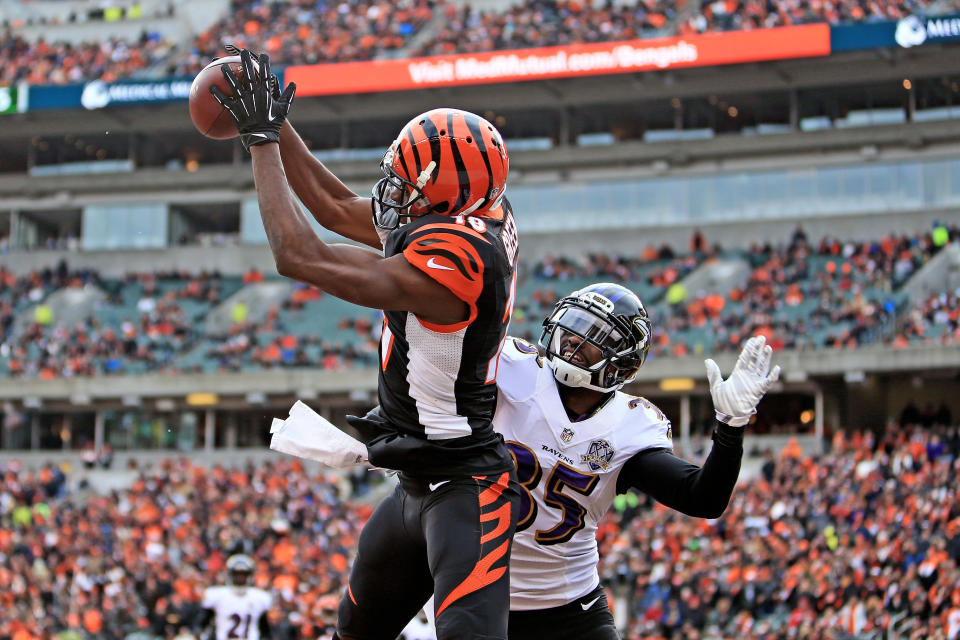 CINCINNATI, OH - JANUARY 3: Wide receiver A.J. Green #18 of the Cincinnati Bengals catches a pass for a touchdown while being defended by defensive back Shareece Wright #35 of the Baltimore Ravens during the third quarter at Paul Brown Stadium on January 3, 2016 in Cincinnati, Ohio. (Photo by Andrew Weber/Getty Images)
