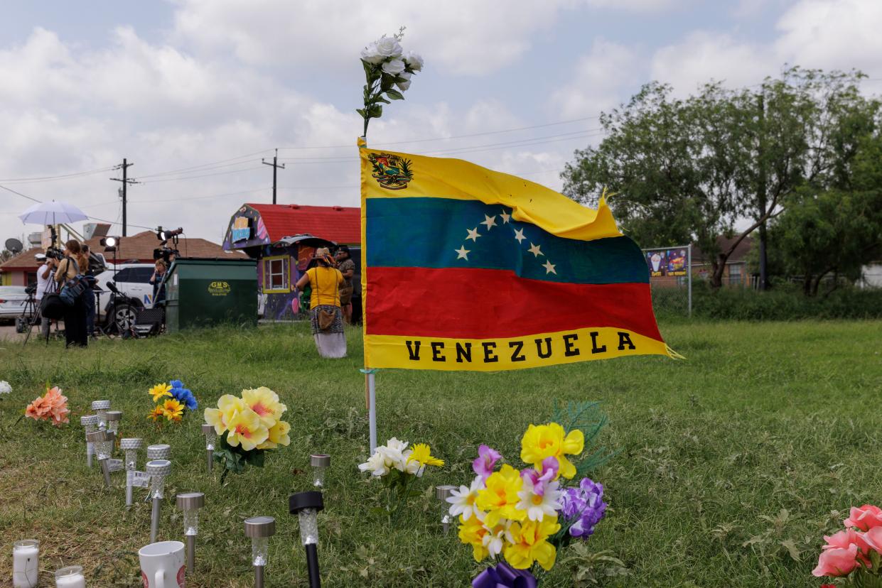 A Venezuelan flag flies at the site of the deadly crash where 8 migrants were run over and killed yesterday waiting at a bus stop on 8 May 2023 in Brownsville, Texas (Getty Images)