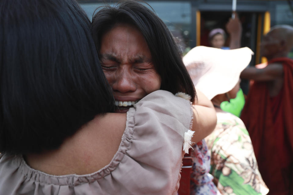 A released prisoner is welcomed by family members and colleagues after she was released Insein Prison Wednesday, April 17, 2024, in Yangon, Myanmar. Myanmar’s jailed former leader Aung San Suu Kyi has been moved from prison to house arrest as a health measure due to a heat wave, the military government said. On Wednesday it also granted amnesty for over 3,000 prisoners to mark this week’s traditional New Year holiday. (AP Photo/Thein Zaw)