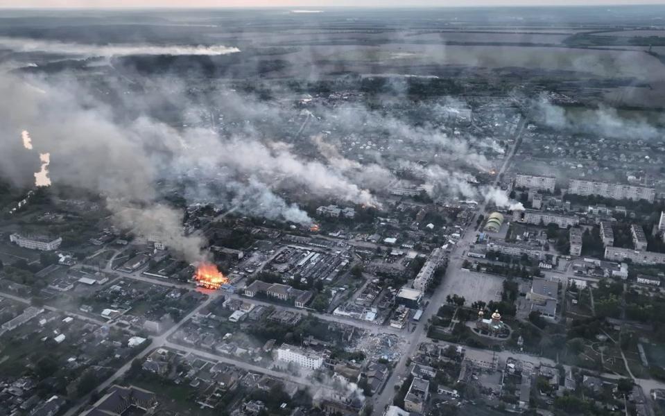 In this screengrab taken from aerial video footage smoke rises from the Ukranian boarder city of Vovchansk, in Chuhuiv Raion, Kharkiv Oblast, which is bombarded daily by heavy artillery on May 17, 2024 in Vovchansk, Ukraine.