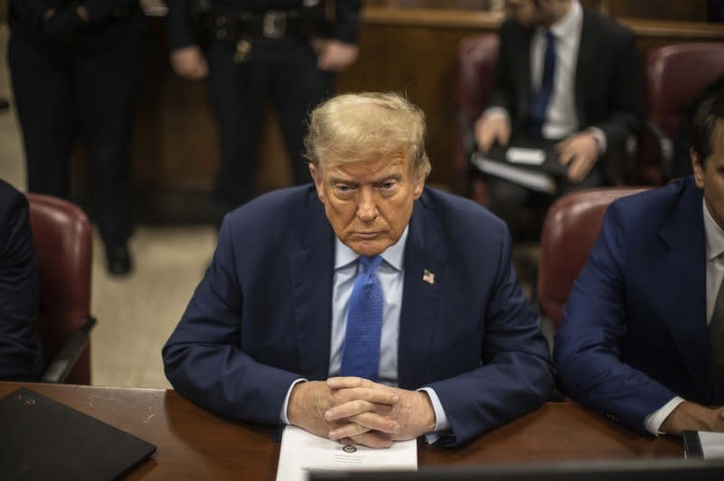 Former President Donald Trump sits in the courtroom waiting for the start of his criminal trial at Manhattan Criminal Court in New York on Friday. Trump is facing charges he allegedly falsified business records to cover up a sex scandal during the 2016 presidential campaign. Pool photo by Dave Sanders/UPI