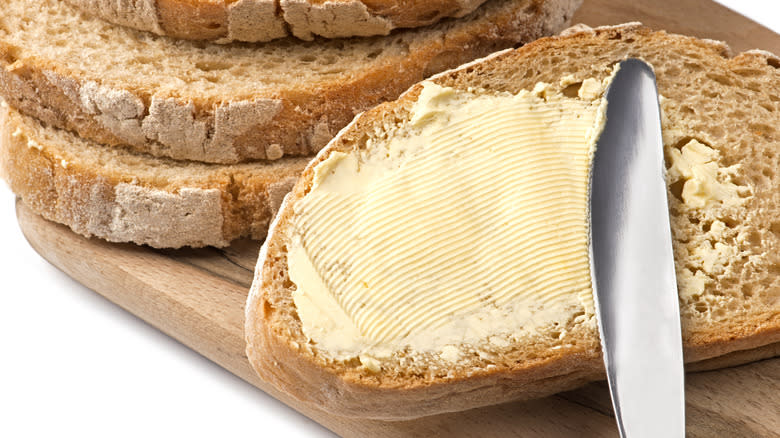 Buttered bread with knife