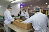 Workers pack vegetables from Agrico in Al-Khor