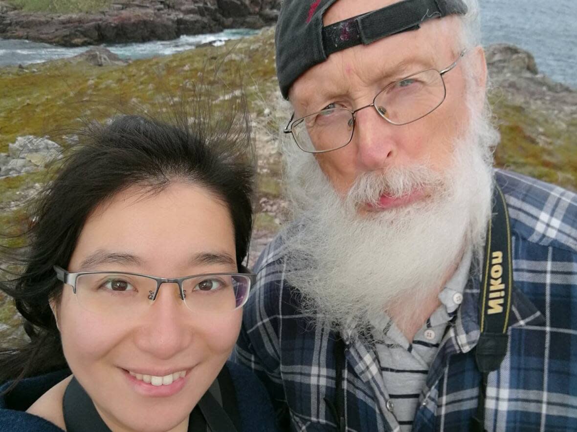 Photographer Ting Ting Chen, left, says her good friend Robert Tilley, right, showed her around Newfoundland and Labrador when she moved to the province five years ago. (Submitted by Ting Ting Chen - image credit)