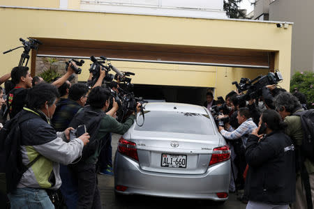 A car that according to local media is believed to transport the former Peruvian President Alan Garcia enters his house, after Uruguay rejected a request for Garcia's asylum, in Lima, Peru December 3, 2018 REUTERS/Mariana Bazo
