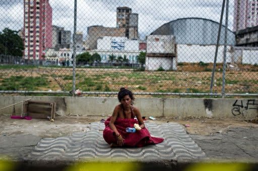 A 40-year old homeless woman sits after receiving food provided by NGOs and social groups during their demonstration against military police's clean-up operation in the area called "Cracolandia (Crackland in English)" in downtown of Sao Paulo, Brazil, on January 14