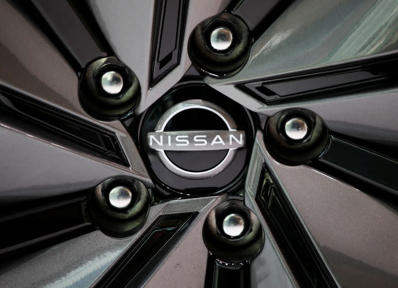 The brand logo of Nissan Motor Corp. is seen on a tyre wheel of the company's car at their showroom in Tokyo