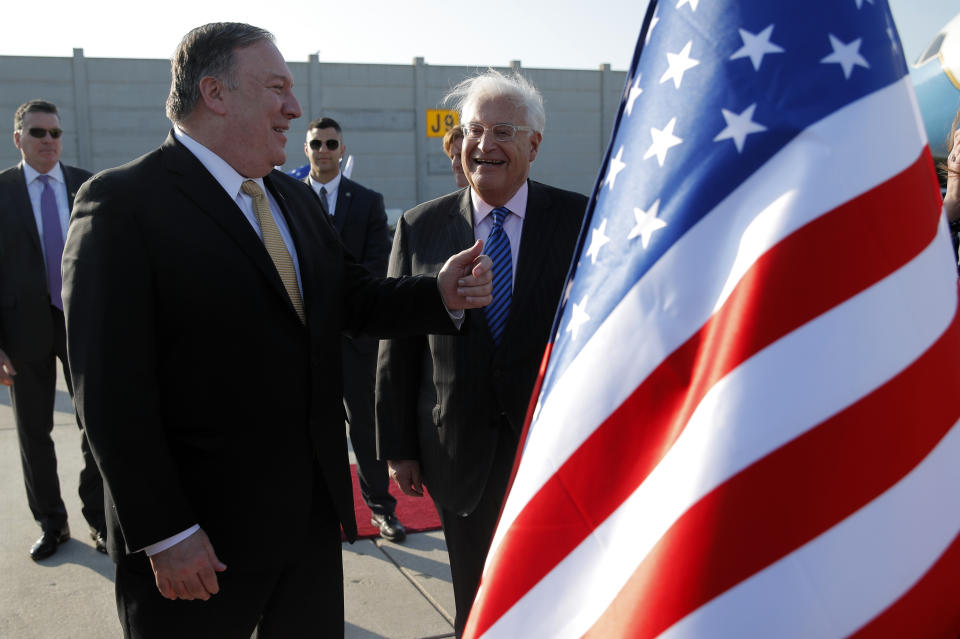 U.S. Secretary of State Mike Pompeo meets U.S. Ambassador to Israel David Friedman upon his arrival at Ben Gurion International Airport, near Tel Aviv, Israel, Wednesday, March 20, 2019. (Jim Young/Pool Image via AP)