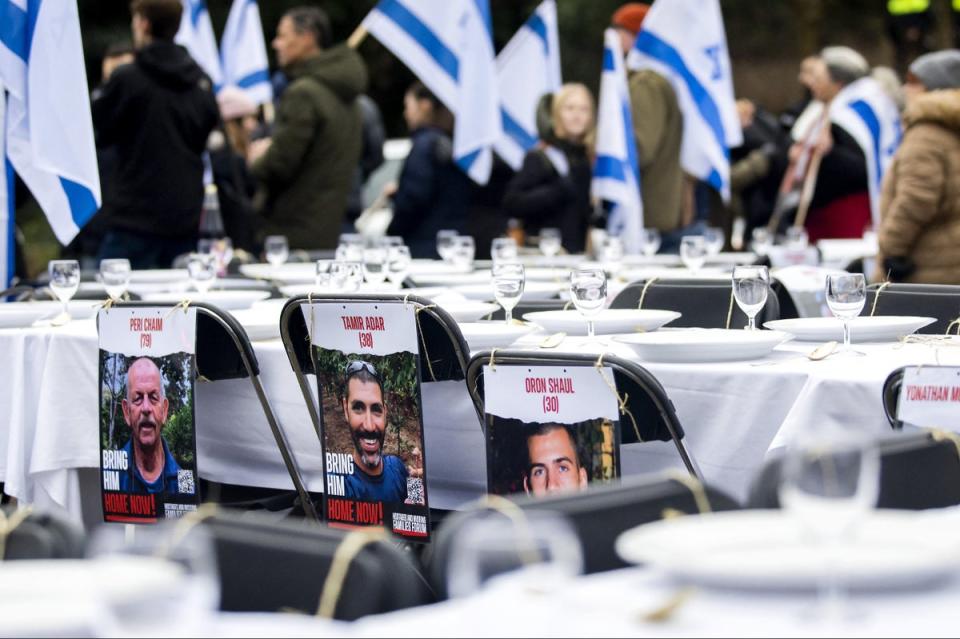 The table marking people who are still being held hostage by Hamas, outside the courtroom at The Hague (ANP/AFP via Getty Images)