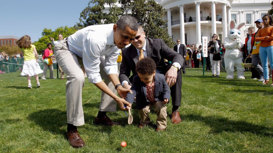 President Barack Obama helps a young participant roll an egg during the White House Easter Egg Roll on the South Lawn of the White House in April 2012. - Chip Somodevilla/Getty Images