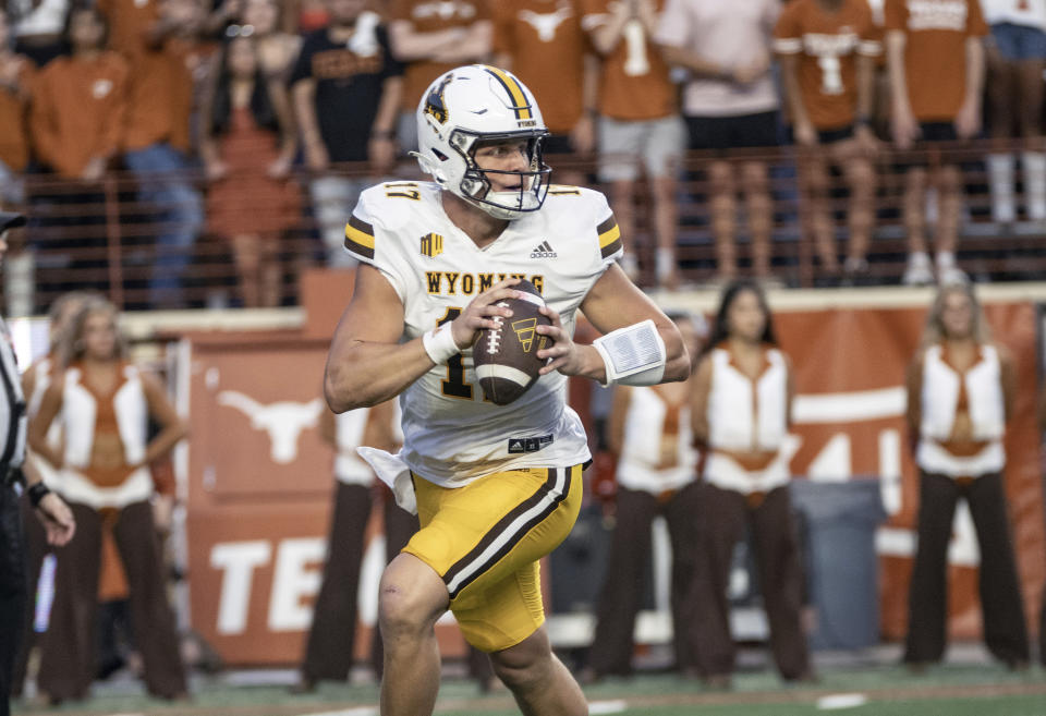 Wyoming quarterback Carson May looks to pass during the first half of the team's NCAA college football game against Texas, Saturday, Sept. 16, 2023, in Austin, Texas. (AP Photo/Michael Thomas)