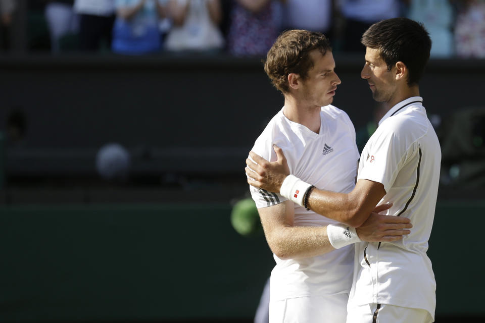 FILE - Andy Murray of Britain, left, is congratulated by Novak Djokovic of Serbia after he won the Men's singles final match at the All England Lawn Tennis Championships in Wimbledon, London, Sunday, July 7, 2013. Murray will play only doubles at his last appearance at the All England Club following his withdrawal from singles after back surgery. (AP Photo/Anja Niedringhaus, Pool, File)