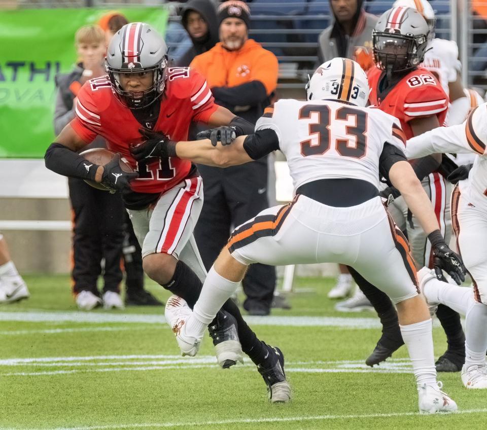 McKinley’s Keith Quincy breaks free from Massillon’s Cody Fair on Saturday, Oct. 21, 2023.