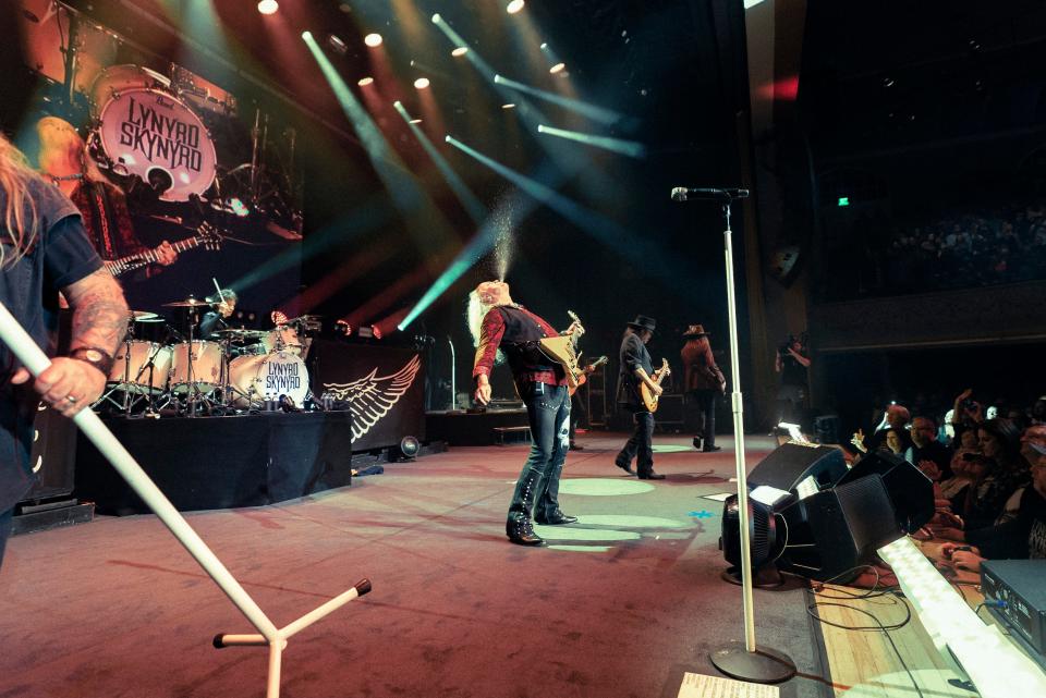 Guitarist Rickey Medlocke (center) cuts loose onstage with Lynyrd Skynyrd.