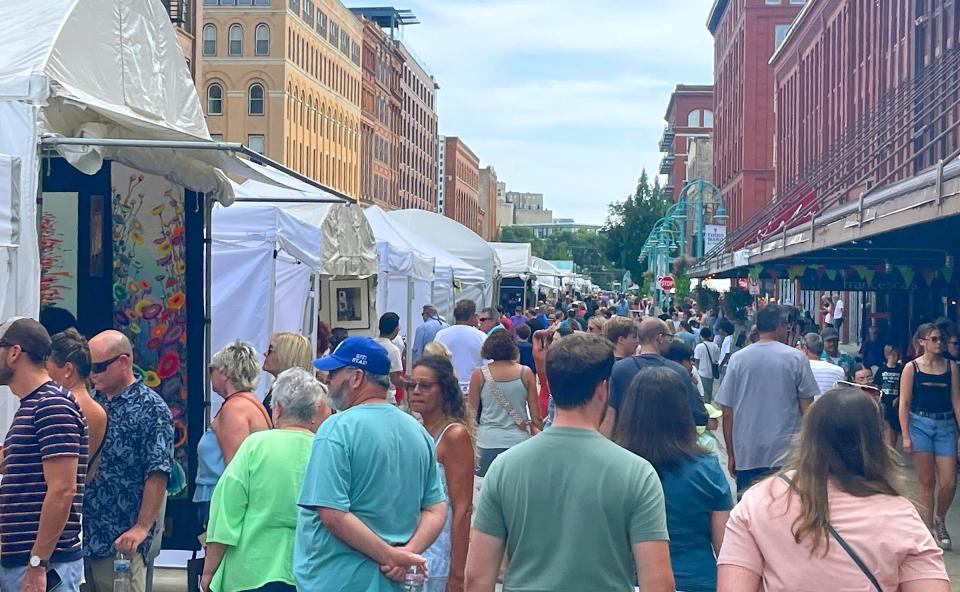 People attend the Third Ward Art Festival on Broadway in The Historic Third Ward on Saturday, Sept. 2, 2023. The annual show ran Saturday and Sunday and featured the work of more than 150 juried artists from around the country.