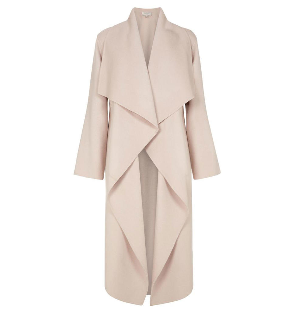 <p>Even a neutral-tone lover like Meghan can appreciate a pop of color — like this light blush coat she wore with her personalized "H" and "M" necklace. <strong>Get the Look:</strong> Simplee Apparel Women's Oversized Waterfall Jacket, $33; <a rel="nofollow noopener" href="https://www.amazon.com/Simplee-Apparel-Oversized-Waterfall-Kardashian/dp/B01MCWINWZ/ref=sr_1_5?s=apparel&ie=UTF8&qid=1515093132&sr=1-5&nodeID=2348891011&psd=1&refinements=p_n_size_browse-vebin%3A2343359011" target="_blank" data-ylk="slk:amazon.com;elm:context_link;itc:0;sec:content-canvas" class="link ">amazon.com</a> Francesca Belted Waterfall Coat, $29; <a rel="nofollow noopener" href="http://www.anrdoezrs.net/links/8029122/type/dlg/sid/pommcoatsMM/http://us.boohoo.com/francesca-belted-waterfall-coat/DZZ53378.html?color=107" target="_blank" data-ylk="slk:boohoo.com;elm:context_link;itc:0;sec:content-canvas" class="link ">boohoo.com</a></p>