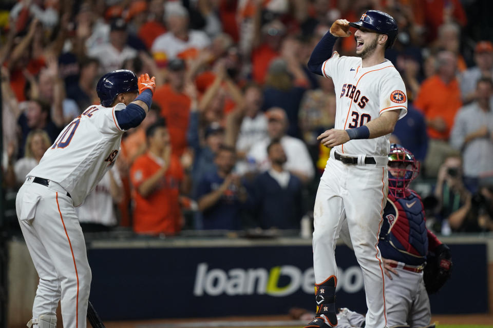 Houston Astros' Kyle Tucker celebrates a three-run home run against the Boston Red Sox during the eighth inning in Game 6 of baseball's American League Championship Series Friday, Oct. 22, 2021, in Houston. (AP Photo/David J. Phillip)