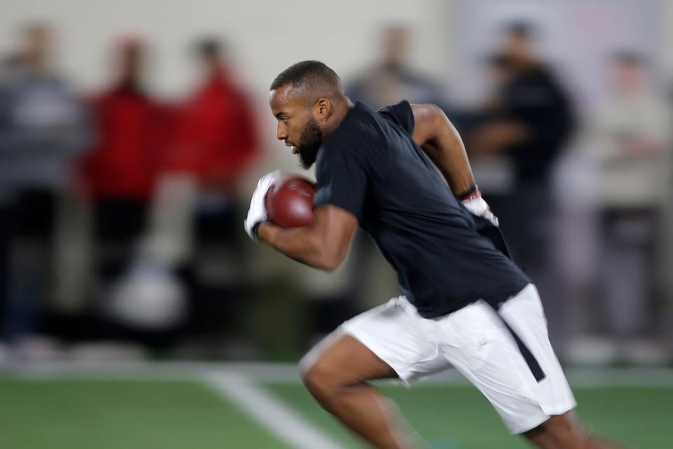 Kennedy Brooks carries the ball during the University of Oklahoma Sooners football Pro Day  inside the Everest Training Center in Norman, Okla., Wednesday, March 9, 2022. 