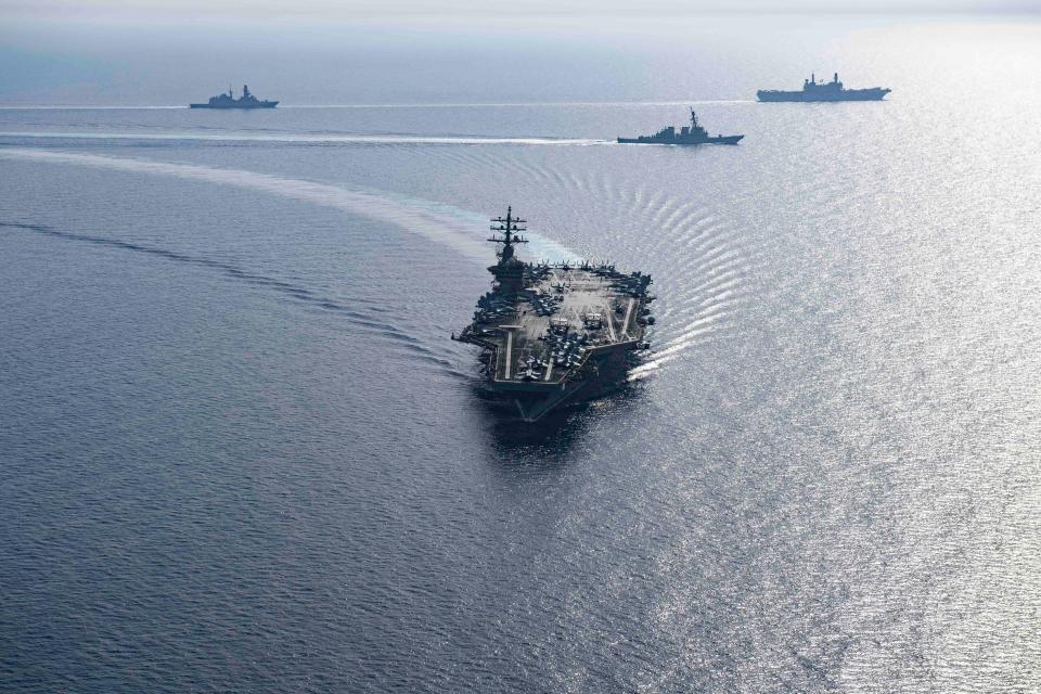 Components of the Dwight D. Eisenhower Carrier Group sail in formation with the Italian Navy through the Red Sea on June 7.