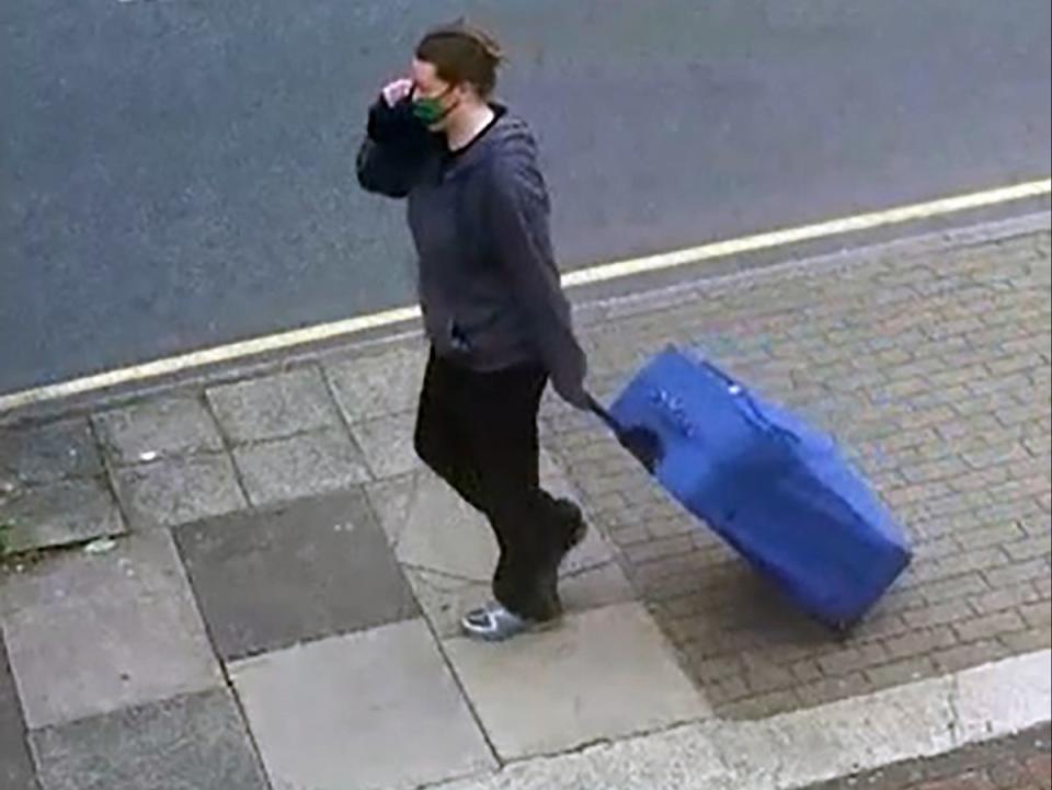 CCV showed Jemma Mitchell carrying a blue suitcase along Chaplin Road on 11 June (PA)
