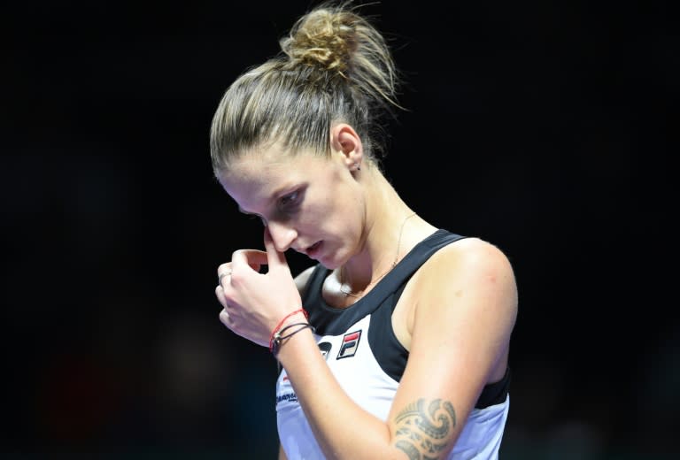 Karolina Pliskova of the Czech Republic reacts as she plays against Russia's Svetlana Kuznetsova at the WTA Finals tennis tournament in Singapore on October 26, 2016