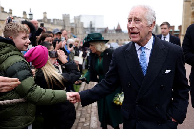 <p>Hollie Adams - WPA Pool/Getty Images</p> King Charles and Queen Camilla greet well-wishers after the Easter Matins Service at St. George's Chapel, Windsor Castle, on March 31, 2024.