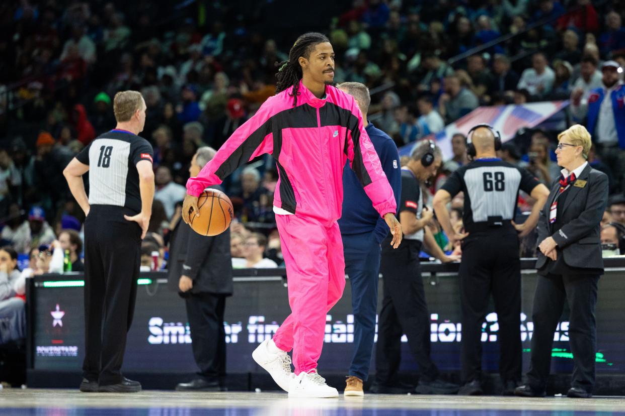 Injured Memphis grizzlies guard Ja Morant (12) dribbles the ball during a timeout in the third quarter against the Philadelphia 76ers at Wells Fargo Center.