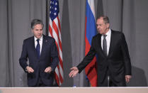 US Secretary of State Antony Blinken, left, and Russian Foreign Minister Sergey Lavrov take their seats on the occasion of their meeting on the sidelines of an Organization for Security and Co-operation in Europe (OSCE) meeting, in Stockholm, Sweden, Thursday, Dec. 2, 2021. (Jonathan Nackstrand/Pool Photo via AP)