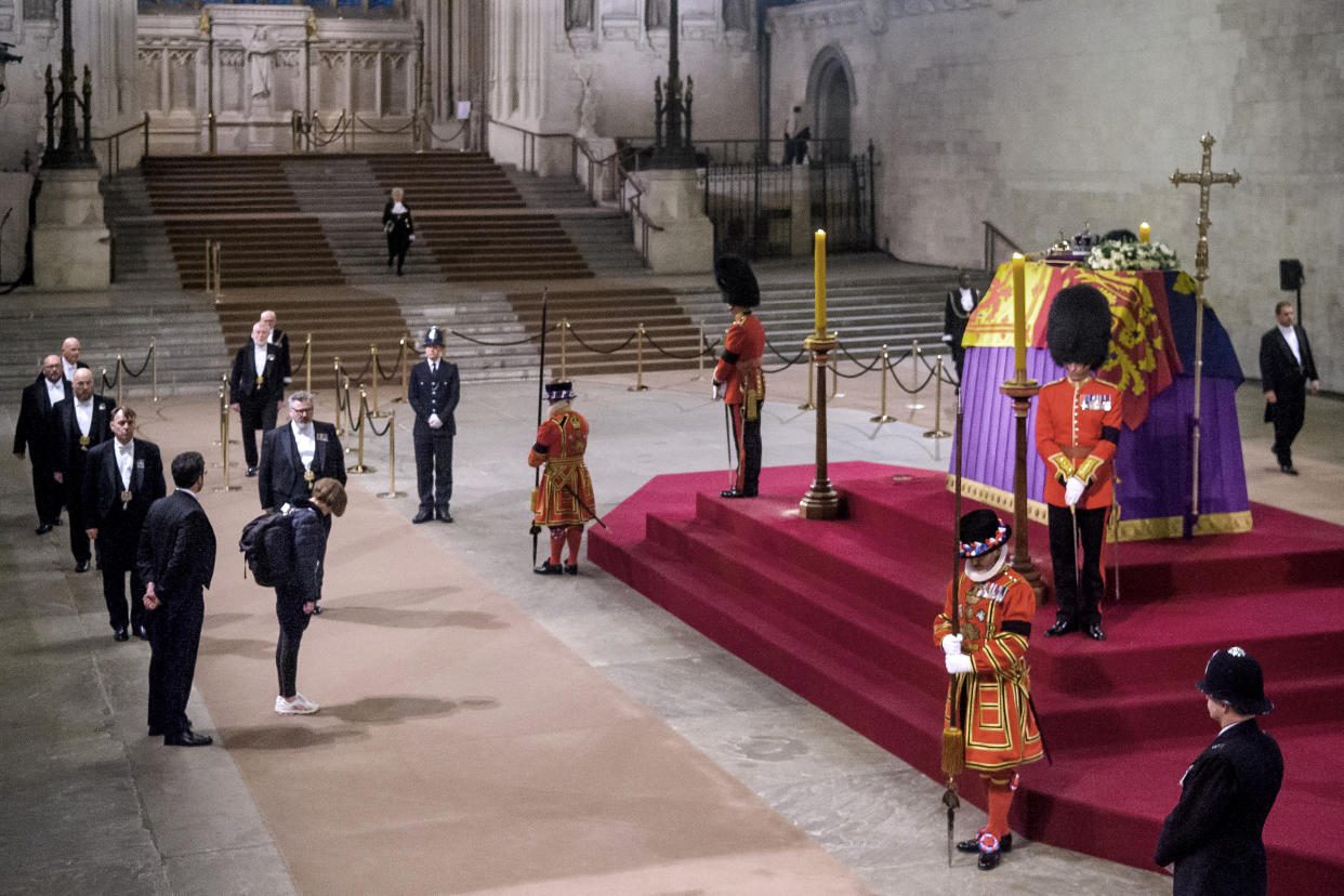 LONDON, ENGLAND - SEPTEMBER 19: The last person queuing, Chrissy Heerey, pays her homage to the Queen Elizabeth II lying in state in Westminster Hall on September 19, 2022 in London, United Kingdom. Queen Elizabeth II is lying in state at Westminster Hall until the morning of her funeral to allow members of the public to pay their last respects. Elizabeth Alexandra Mary Windsor was born in Bruton Street, Mayfair, London on 21 April 1926. She married Prince Philip in 1947 and acceded to the throne of the United Kingdom and Commonwealth on 6 February 1952 after the death of her Father, King George VI. Queen Elizabeth II died at Balmoral Castle in Scotland on September 8, 2022, and is succeeded by her eldest son, King Charles III. (Photo by Laura Lezza/Getty Images)