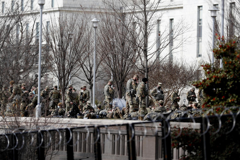 National Guard troops continue to be deployed around the Capitol one day after the inauguration of President Joe Biden, Thursday, Jan. 21, 2021, in Washington. (AP Photo/Rebecca Blackwell)