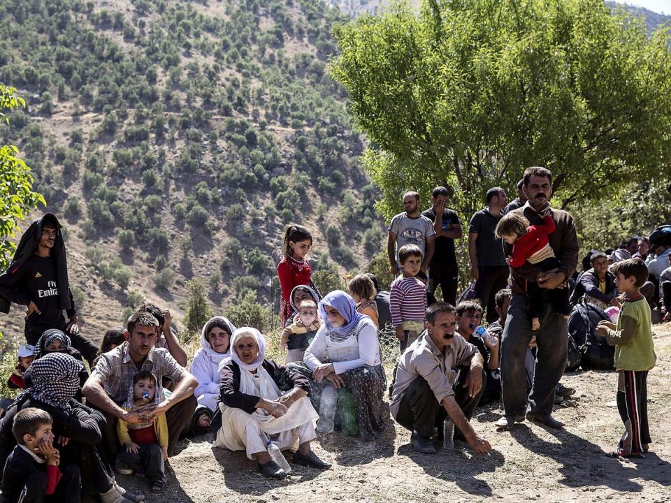 Isis conquered the Kurdish towns of Sinjar and Zumar in August 2014, forcing thousands of civilians to flee their homes. Pictured are a group of Yazidi Kurds who have fled (Rex)