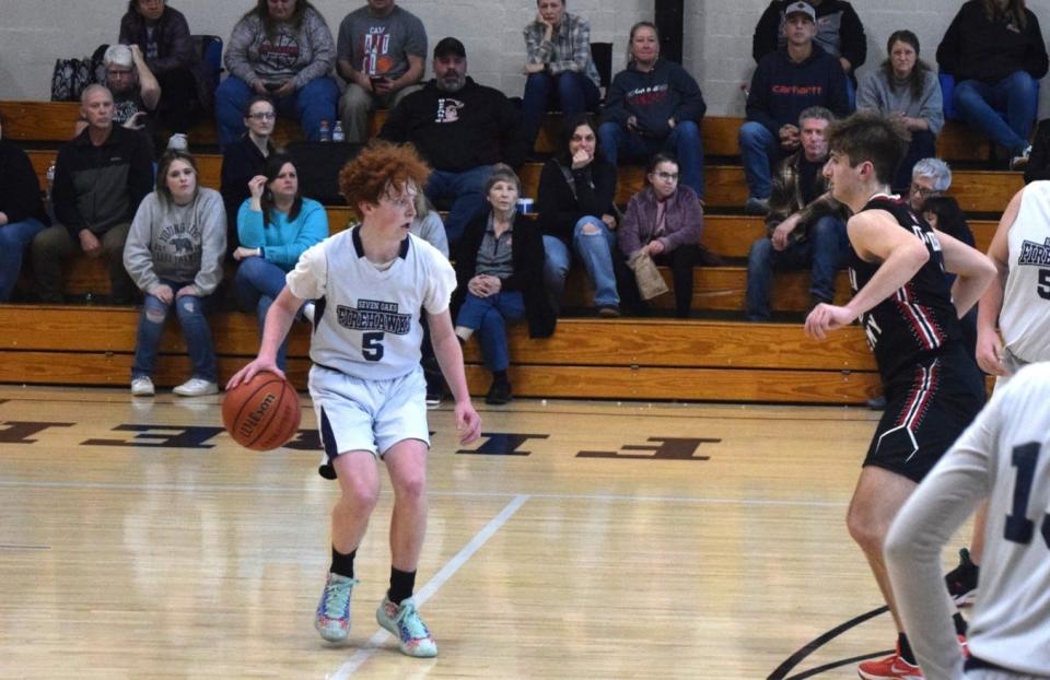 Seven Oaks' Jaden Davison looks for an opening in the defense during a home boys' basketball game this season.