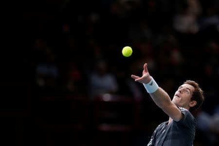 Andy Murray of Britain serves the ball during his men's singles tennis match against Grigor Dimitrov of Bulgaria in the third round of the Paris Masters tennis tournament at the Bercy sports hall in Paris, October 30, 2014. REUTERS/Benoit Tessier