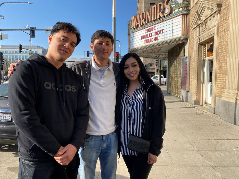 Lizbeth De La Cruz Santana, a grad student at UC Davis, stands with Danilo Castillo and David Paredes after a campaign event for U.S. Senator Elizabeth Warren in Fresno