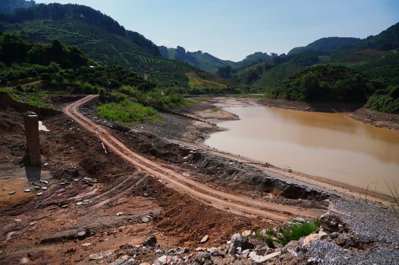 Dam that collapsed following heavy rainfall is seen at the Shazixi reservoir in Yangshuo